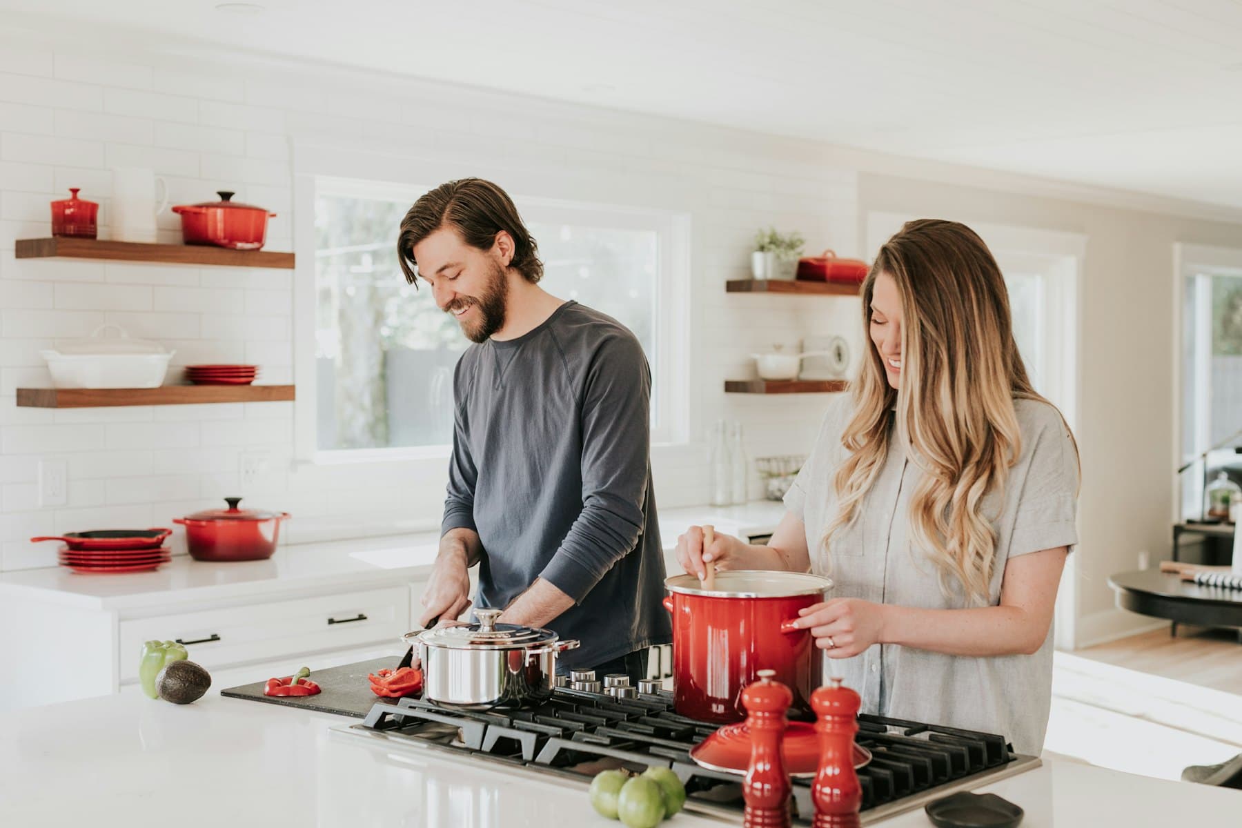 A man and a woman in their kitchen