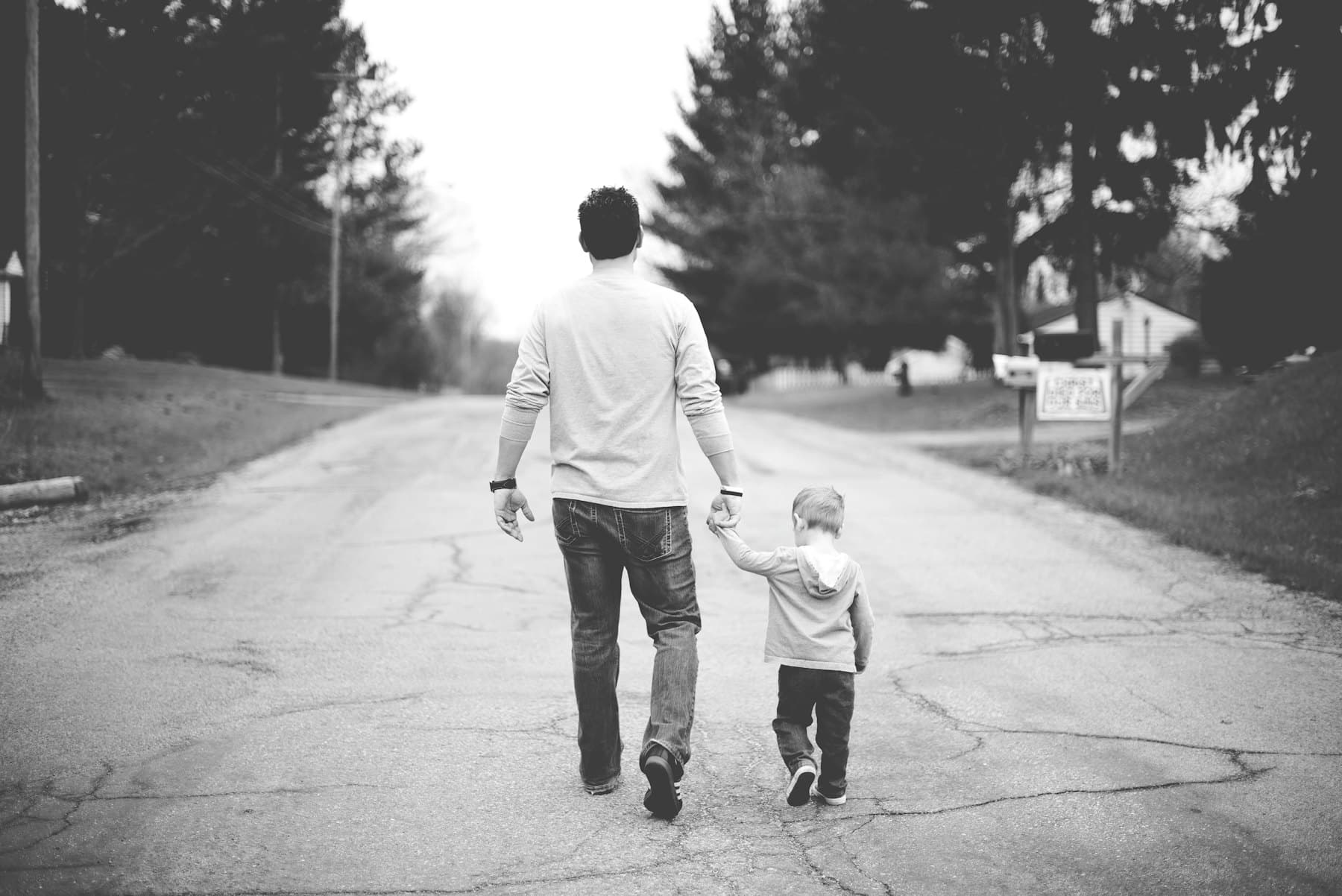 A man holding a baby's hand