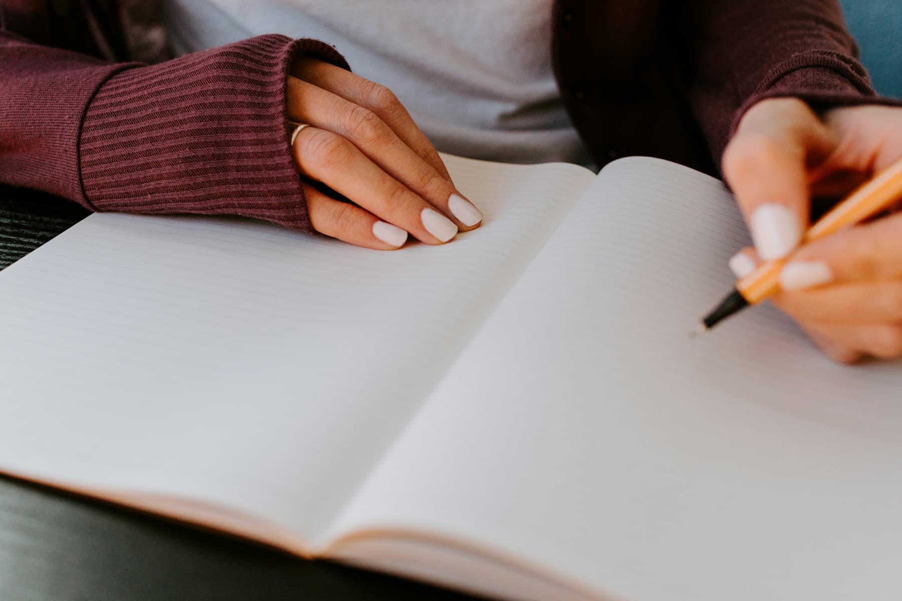 A person writing on paper