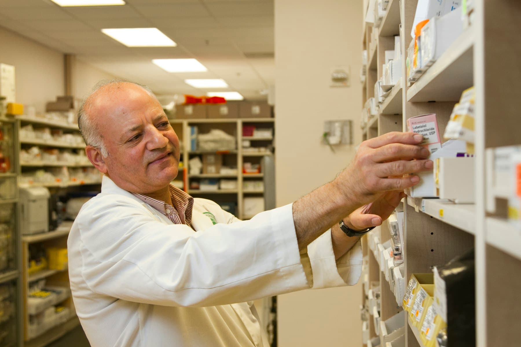 A pharmacist reading a prescription
