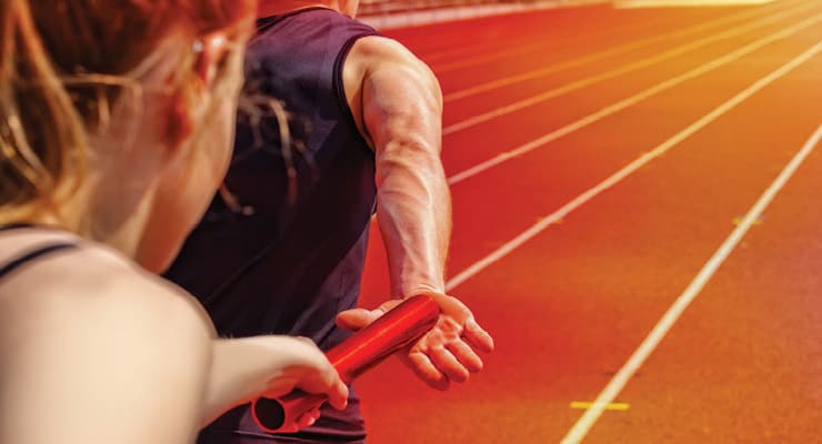 Runner passing a baton on a track, symbolizing the handoff after a clinical trial ends