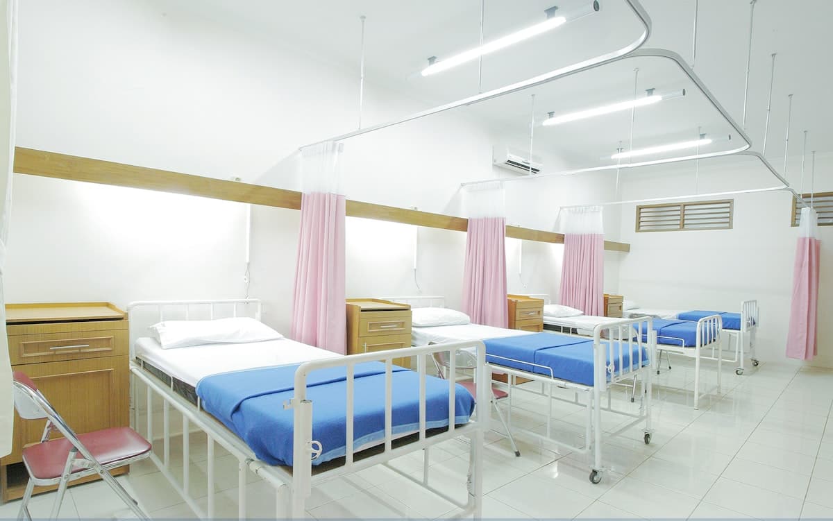 Hospital ward representing emergency room challenges for rare disease patients like sickle cell and Addison's disease
