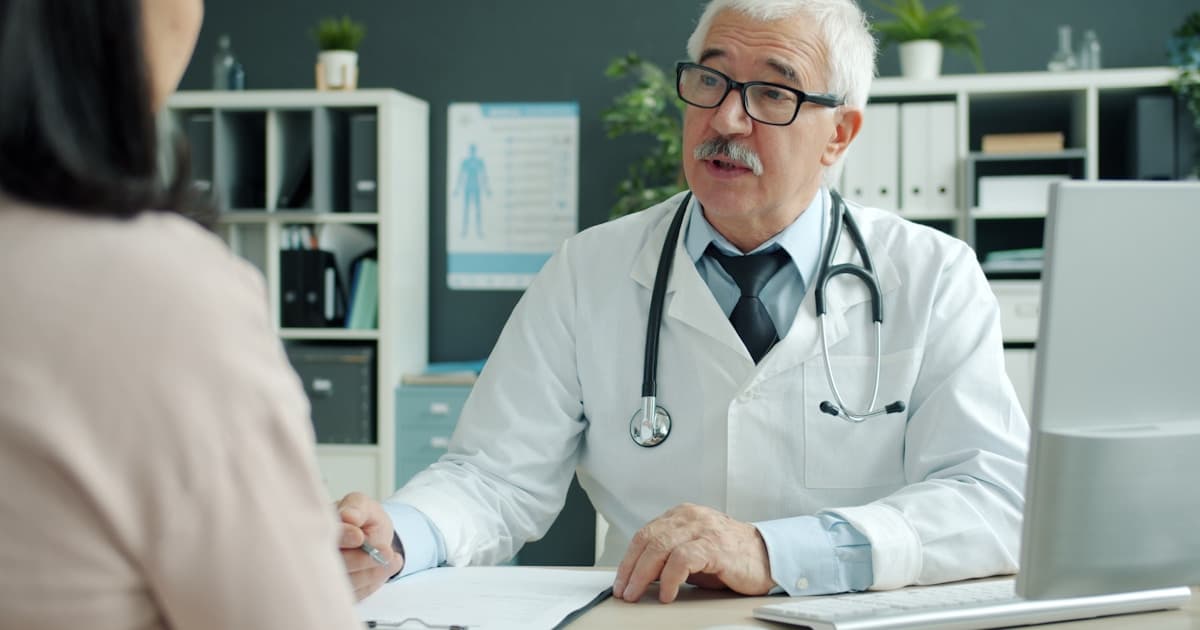 Doctor speaking with a patient during a medical consultation