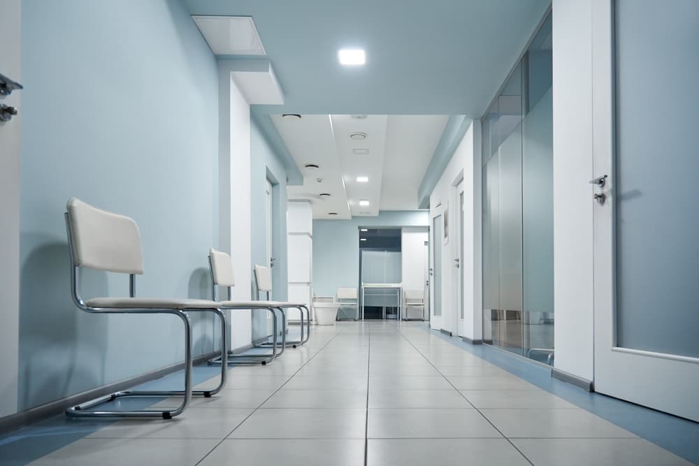 Empty clinic chairs representing the rare disease clinical trial enrollment slowdown despite record FDA orphan drug approvals