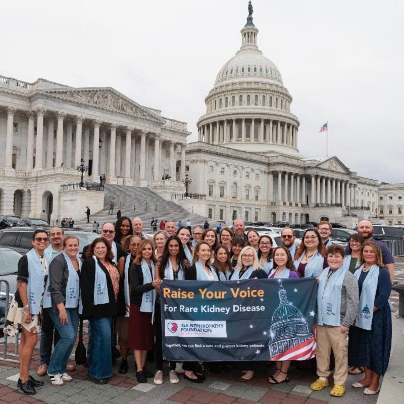 IgA Nephropathy Foundation advocates holding a Raise Your Voice For Rare Kidney Disease banner in front of the U.S. Capitol